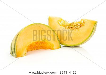 Group Of Two Slices Of Fresh Melon Cantaloupe Variety Isolated On White Background