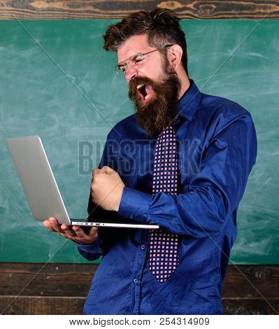 Technology Blows His Mind. Hipster Teacher Aggressive With Laptop Goes Mad About Modern Technology. 