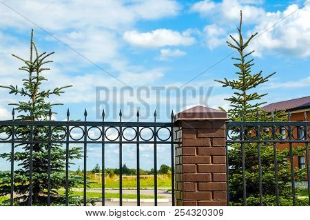Fire Tower. Ancient Central Fire Tower And Fire Station Building. Metal Fence.