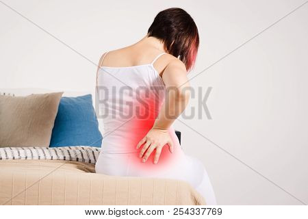 Back Pain, Kidney Inflammation, Woman Suffering From Backache At Home, Painful Area Highlighted In R