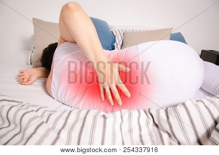 Back Pain, Kidney Inflammation, Woman Suffering From Backache At Home, Painful Area Highlighted In R