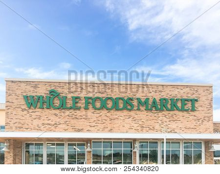 Close-up Logo Of Whole Foods Market At Store Entrance Facade