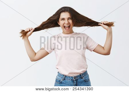 Expressing Herself To Fullest. Portrait Of Rebellious Playful And Stylish Carefree European Female P