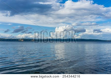 Billowing Clouds Hover Over Maury Island In Washington State.