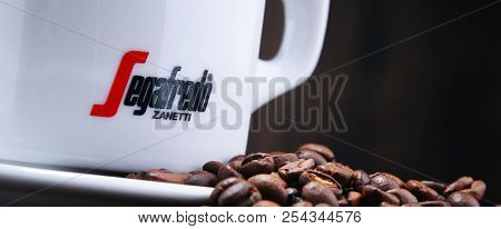 Composition With Cup And Beans Of Segafredo Zanetti Coffee