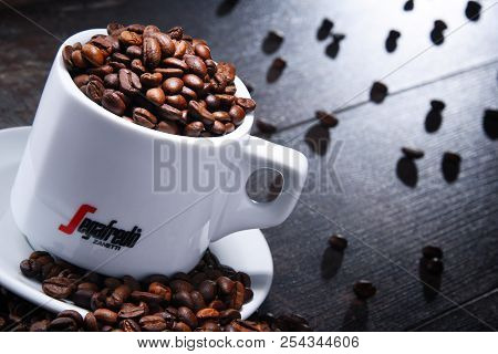 Composition With Cup And Beans Of Segafredo Zanetti Coffee