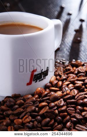 Composition With Cup And Beans Of Segafredo Zanetti Coffee