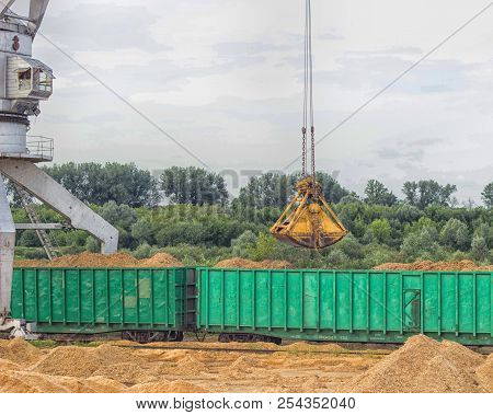 Port Cargo Crane Loads Wood Chips Into Railway Cars, Kindling-wood