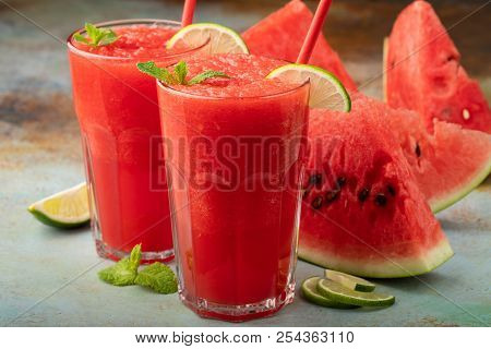 Watermelon Slushie With Lime, Summer Refreshing Drink In Tall Glasses On A Blue Rusty Background