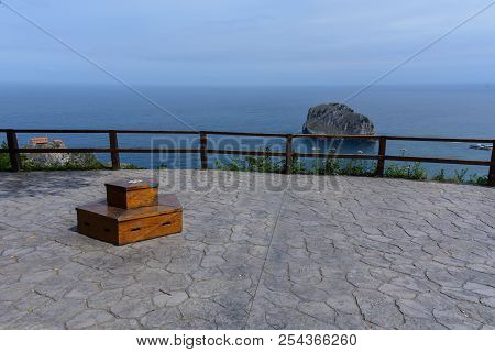 A Viewpoint Showing The Atlantic Ocean, A Little Rocky Island & San Juan De Gaztelugatxe At The Basq
