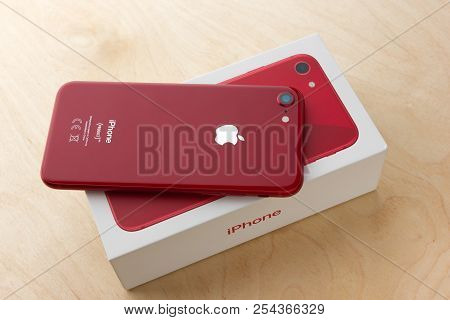 May 2018. Apple Iphone 8 (product) Red And Box Lies On A Wooden Table. A New Smartphone From The Com