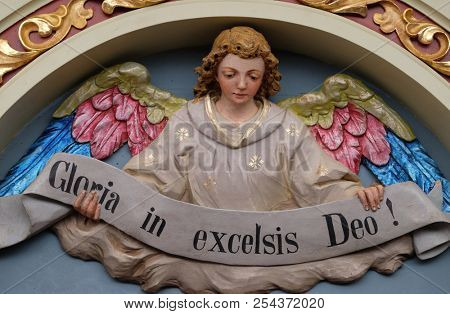 STITAR, CROATIA - NOVEMBER 30: Angel with Gloria in excelsis Deo Banner, Nativity Scene, altarpiece in the church of Saint Matthew in Stitar, Croatia on November 30, 2017.
