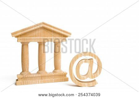 An Email Symbol And A Bank Building Or Government. Introduction Of Electronic Tools And Technologies