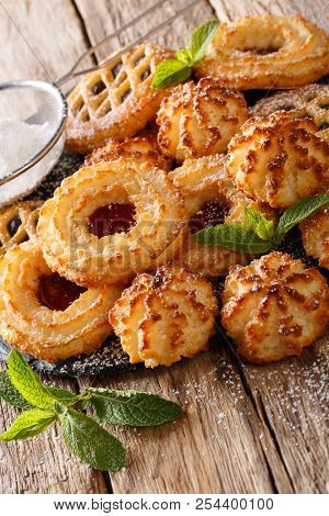 Beautiful Biscuit Cookie Rocher Coco, Couque And Marimbas Is Decorated With Mint Close-up. Vertical