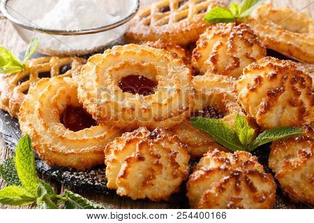 Tasty Cookies Rocher Coco, Couque And Marimbas Decorated With Mint Close-up. Horizontal