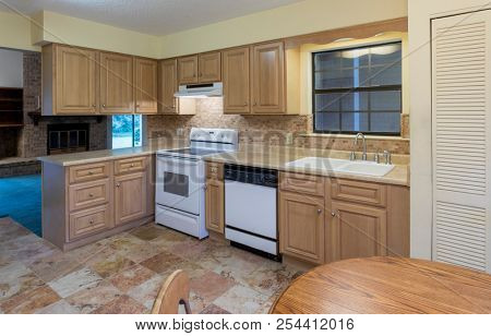 Simple American kitchen in need of remodel. 