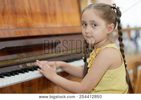 Belarus, Gomel, May 29, 2018. The Kindergarten Is Central. Open Day.child Plays The Piano.preschool 