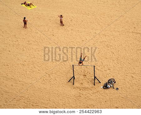 Santander,Spain - July 20, 2018: El Sardinero waterfront promenade and surfer beach. El Sardinero is a popular beach located in the Spanish city of Santander, Cantabria