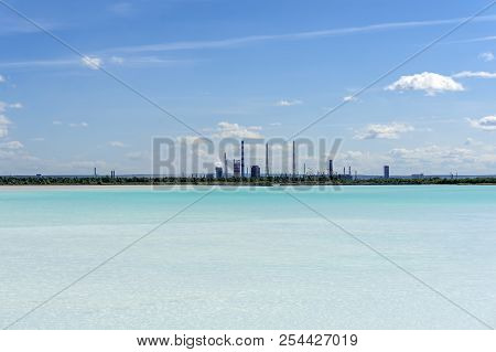 Sludge Settler Of Soda Factory With Beautiful Turquoise Water On The Background Of Industrial Landsc