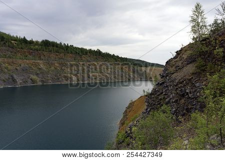Lake With Blue Water, A Place Of Recreation Formed On The Site Of Old Abandoned Quarry