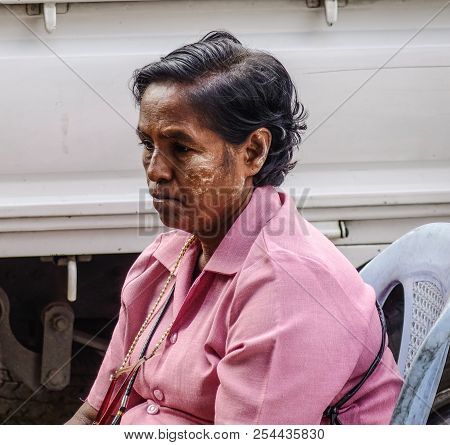 Yangon, Myanmar - Feb 1, 2017. Portrait Of Burmese Woman At Street Market In Yangon, Myanmar.