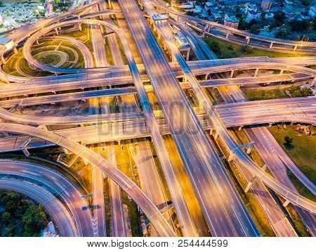 Top View Of Highway Road Junctions At Night. The Intersecting Freeway Road Overpass The Eastern Oute