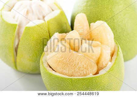 Fresh And Peeled Pomelo(shaddock), Grapefruit With Slices Isolated On White Background