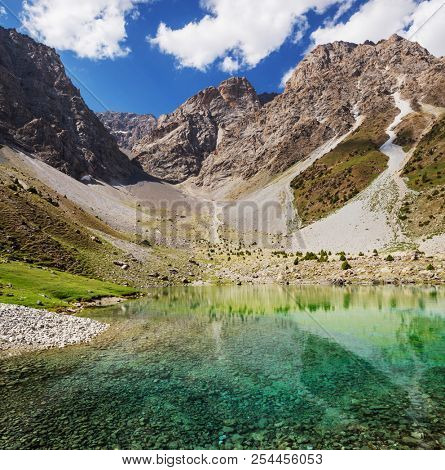 Beautiful serene lake in  Fann mountains (branch of Pamir) in Tajikistan.