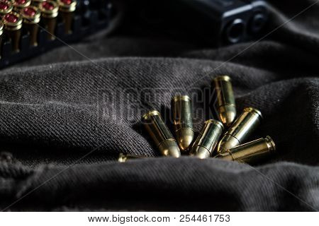 9Mm Semi Autometic Hand Gun With Fmj Bullet On Fabric