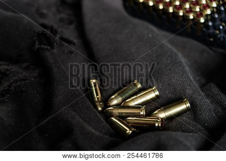 Full Metal Jacket 9Mm Ruger Bullet On Cloth Texture