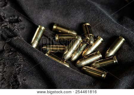 Full Metal Jacket 9Mm Ruger Bullet On Cloth Texture