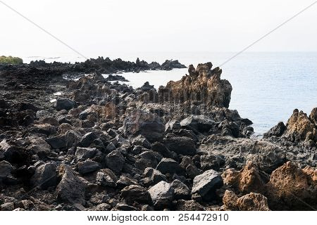 Non Classical View Of The Coast Of Lanzarote Formed Mostly By Cooled Lava During A Sunny Day. Here W