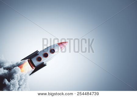 Launching Rocket On Gray Background. Startup And Entrepreneurship Concept. 3d Rendering