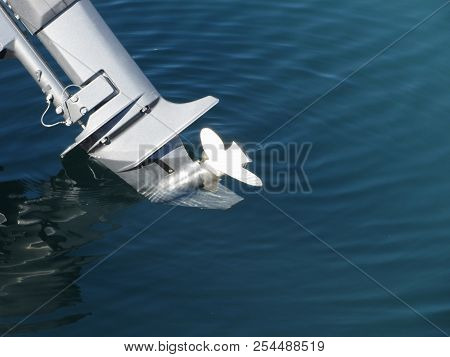Outboard Boat Motor Tuned Up And Trying On The First Run On Sea Background