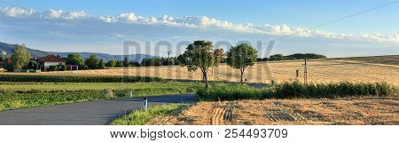 The Road Winding Through The Fields Near The Village Oberrohrbach On A Summer Day. Panoramic View. L