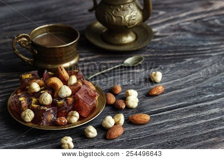 Oriental Arabian Sweets With Different Nuts A Cup Of Coffee. Eastern Sweets. Traditional Turkish Del