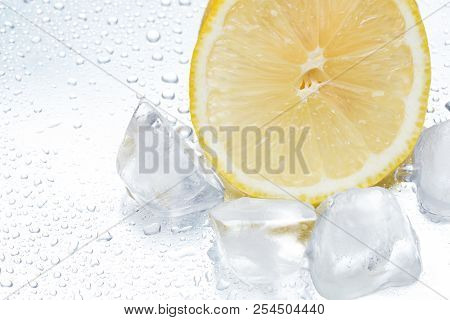 Lemon Ring With Ice On A Silvery Background Closeup