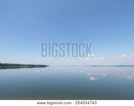 Symmetrical Landscapes Of Artificial European Goczalkowice Reservoir In Poland With Beauty Clouds On