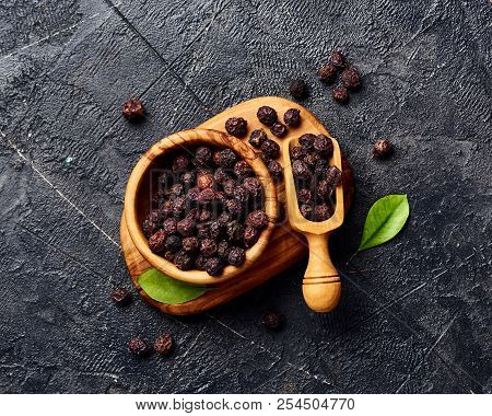 Dried Hawthorn Fruits On Black Background. Top View Of Crataegi Fructus.