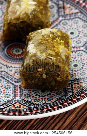 Turkish Dessert Fıstık Ezmesi Baklava With Pistachio On Wooden Table.