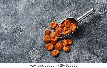 Dried Apricots On Gray Background With Copy Space. Top View.
