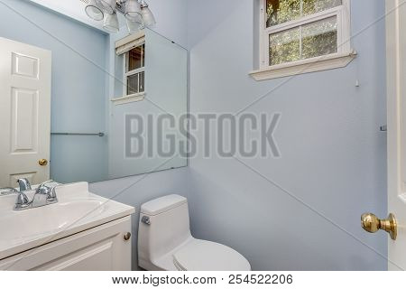 Classic Half Bathroom With A Small Window.