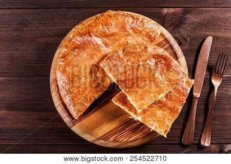 Ajarian Khachapuri Traditional Georgian Cheese Pastry On Cutting Board. Homemade Baking. Top View.