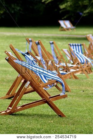 Folding Chairs Set Up At A Park