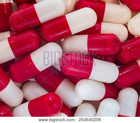Macro Photo Shot Close-up Of Capsule Medicine White Red Color
