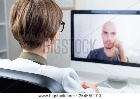 Digital Health Concept: Practicing Physician Having Online Meeting With A Patient. Medical Doctor Co