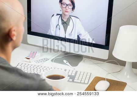 Digital Health Concept: A Patient Having Online Meeting With A Practicing Physician From Home. Medic
