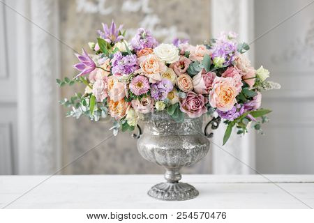 Gorgeous Bouquet Of Different Flowers. Floral Arrangement In Vintage Metal Vase. Table Setting. Lila