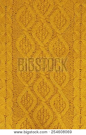 The Texture Of An Orange Autumn Sweater. Knitted Background. Knitted Texture. A Sample Of Knitting F