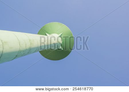 Old Green Water Tank Asia Style On Blue Sky Background.